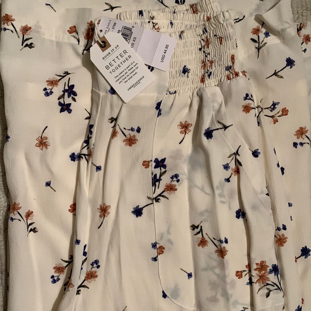 Cream, floral American Eagle pants.